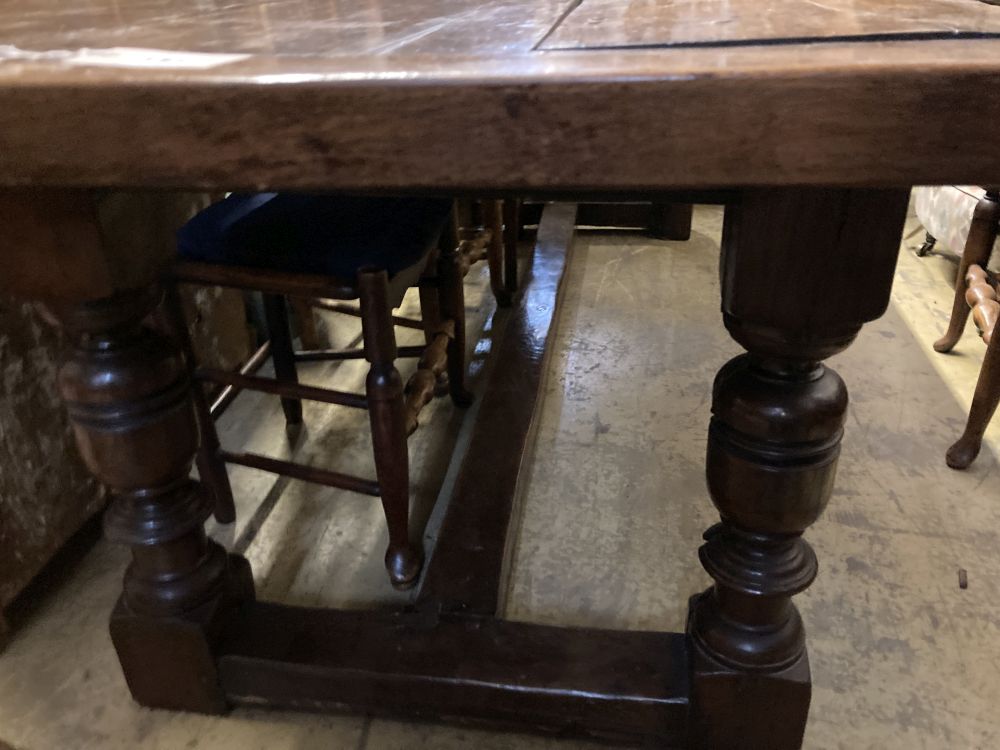 An 18th century style oak refectory dining table, 240 x 83cm height 76cm